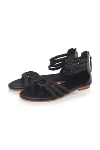 Black braided leather sandals with ankle wrap straps on a white background — handmade by Bali ELF