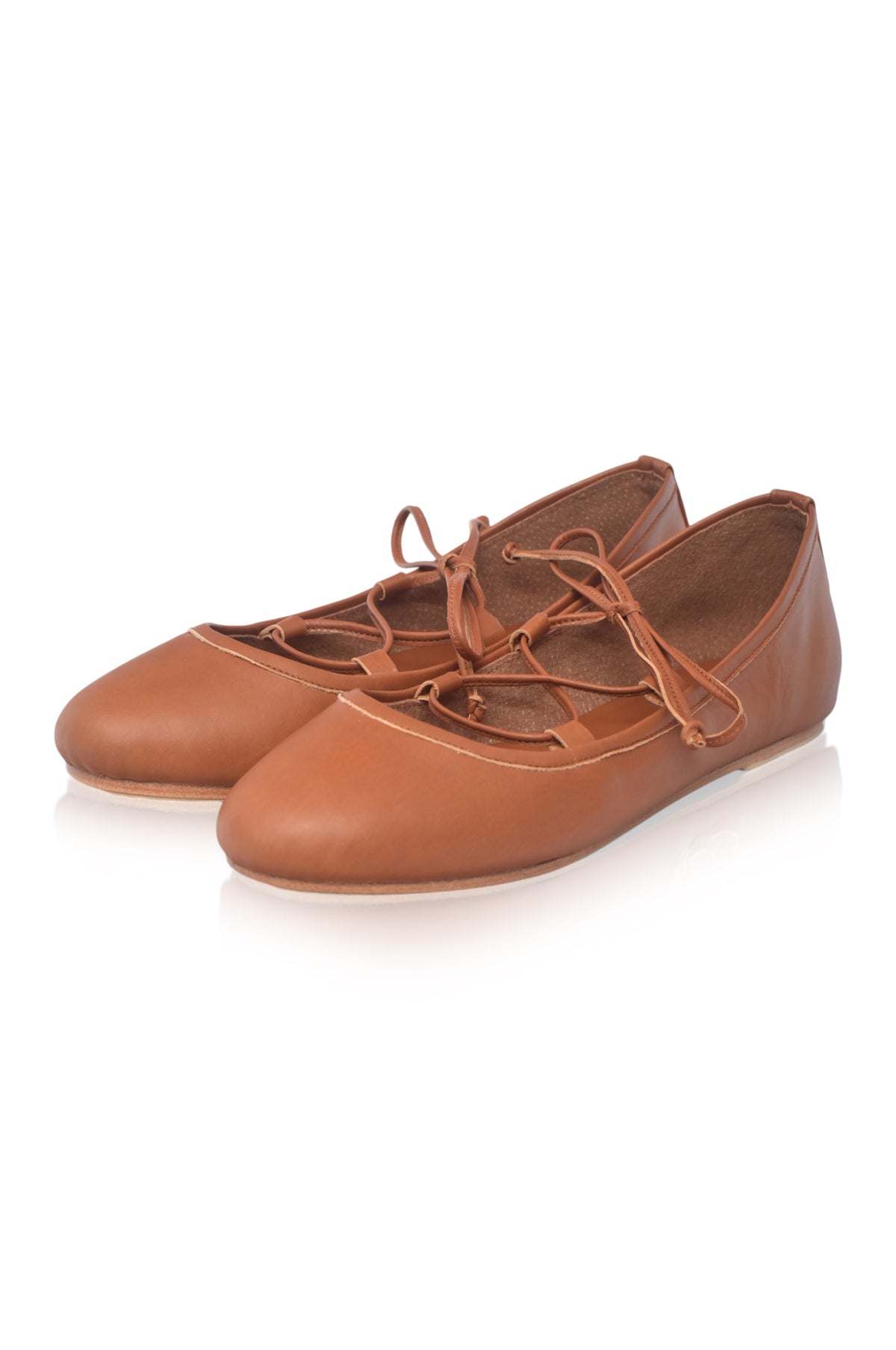 A pair of tan leather lace-up flats with a rounded toe, displayed on a clean white background.
