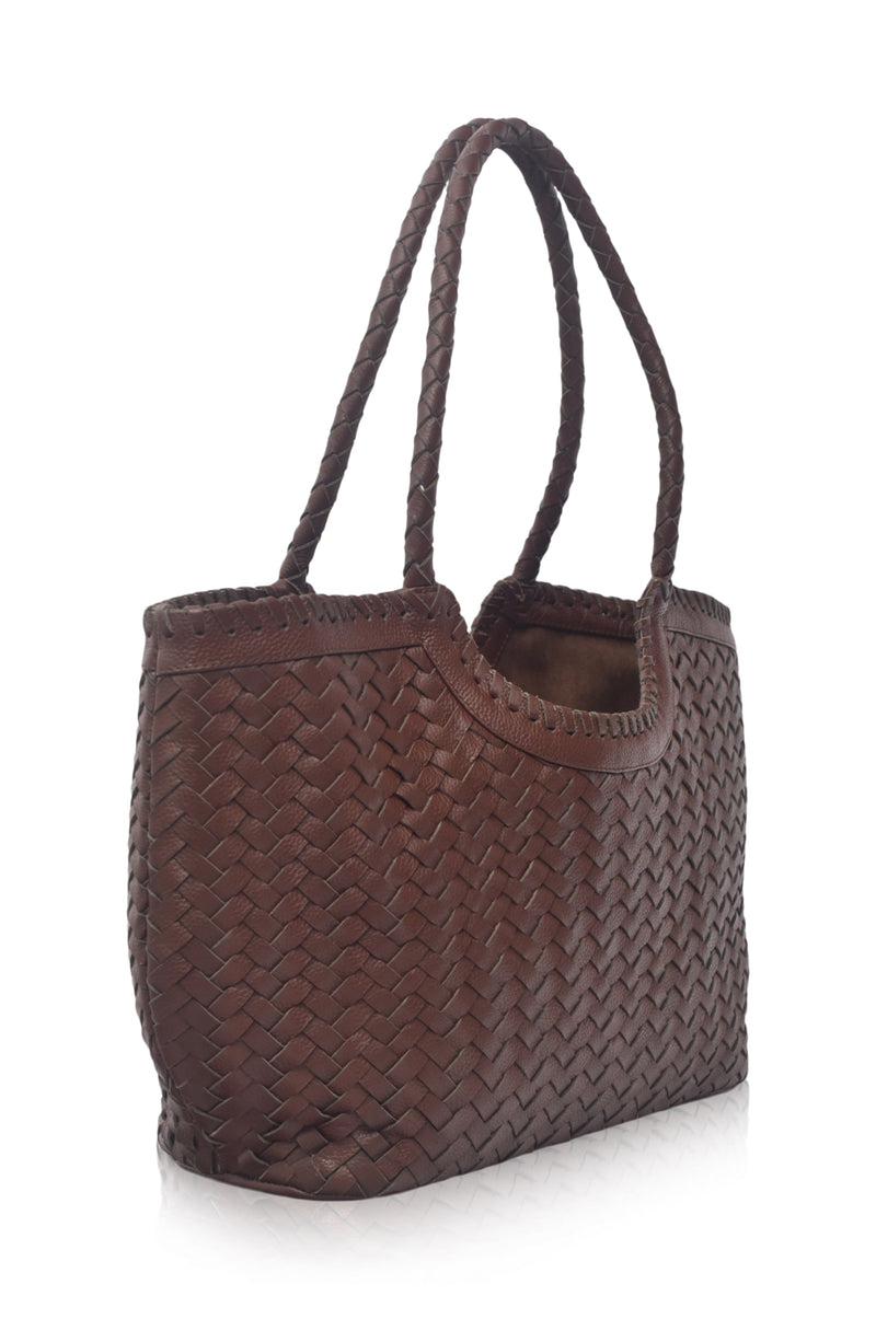 Brown woven handbag on a white background