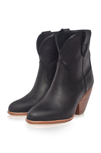 Black leather ankle boots with wooden heel on a white background