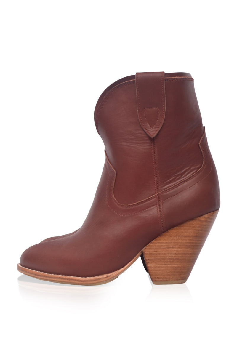 Brown leather ankle boot with wooden heel on a white background
