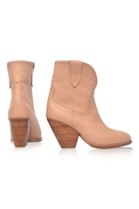 Pair of tan ankle boots with wooden heel on a white background