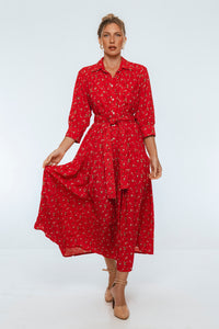 Woman wearing a red dress with a white background