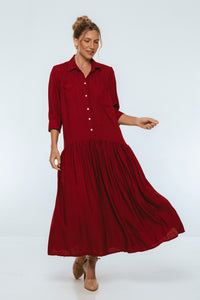 Woman wearing a red dress on a white background