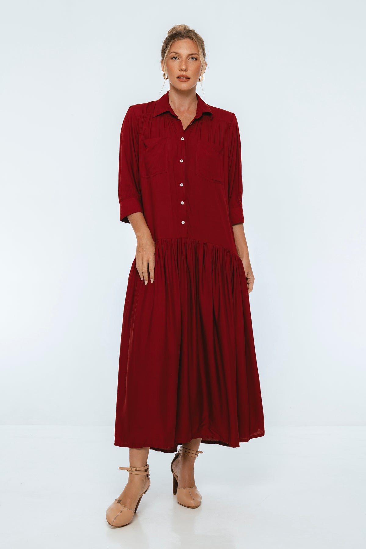 Woman wearing a red dress on a white background