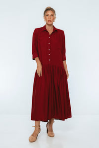 Woman wearing a red dress on a white background
