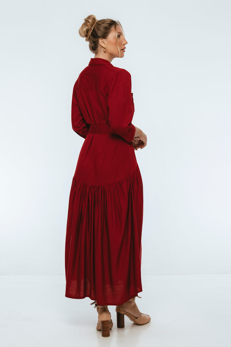 Woman wearing a red dress on a white background