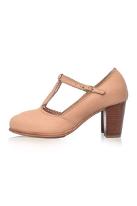 Beige high-heeled shoe with a T-strap on a white background