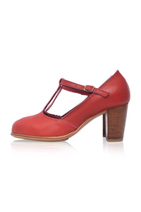 Red high-heeled shoe with a wooden sole on a white background