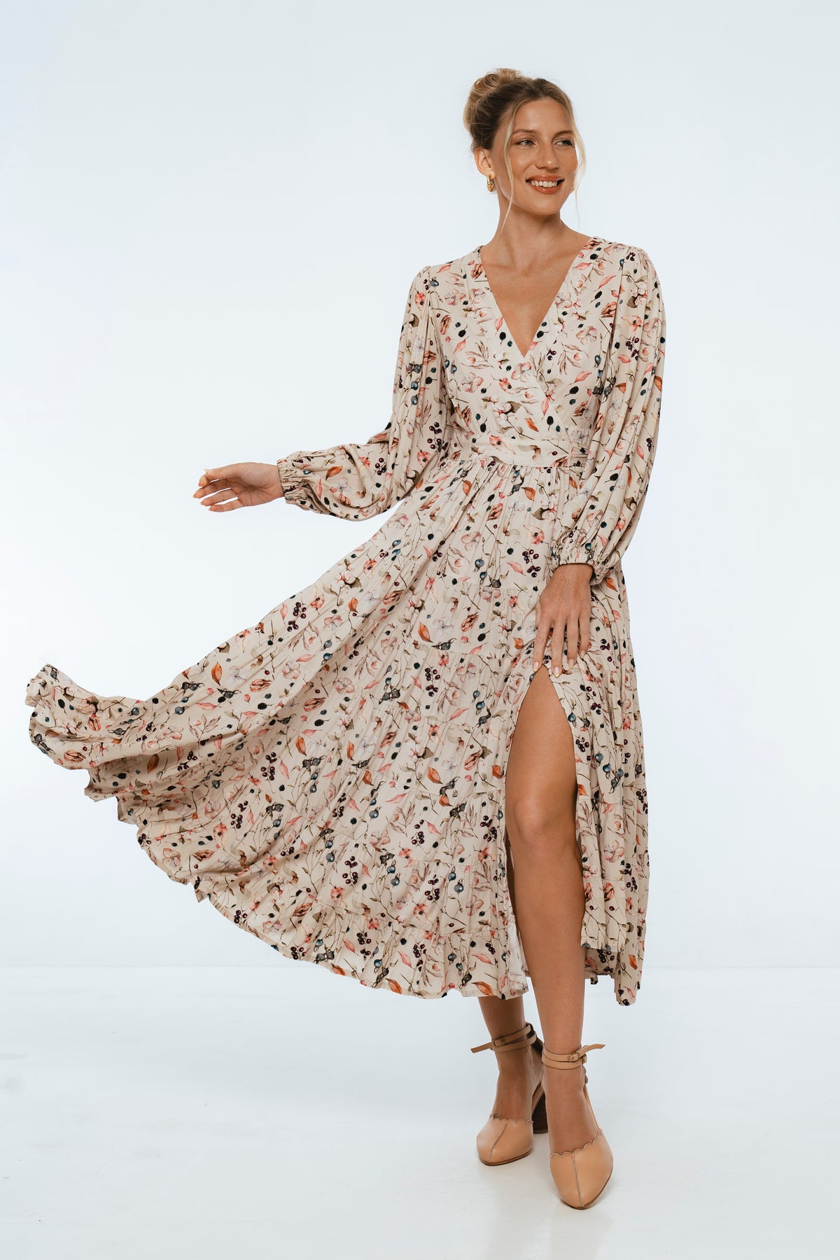 Woman wearing a floral dress on a white background