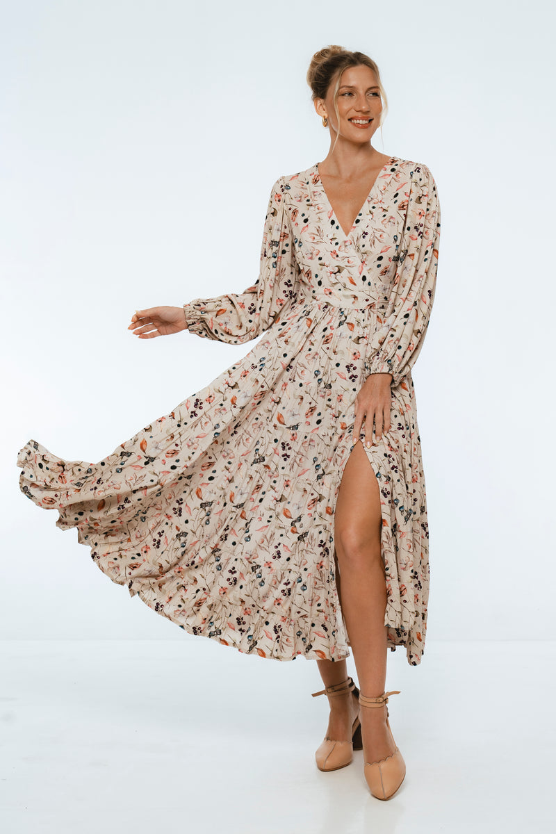 Woman wearing a floral dress on a white background