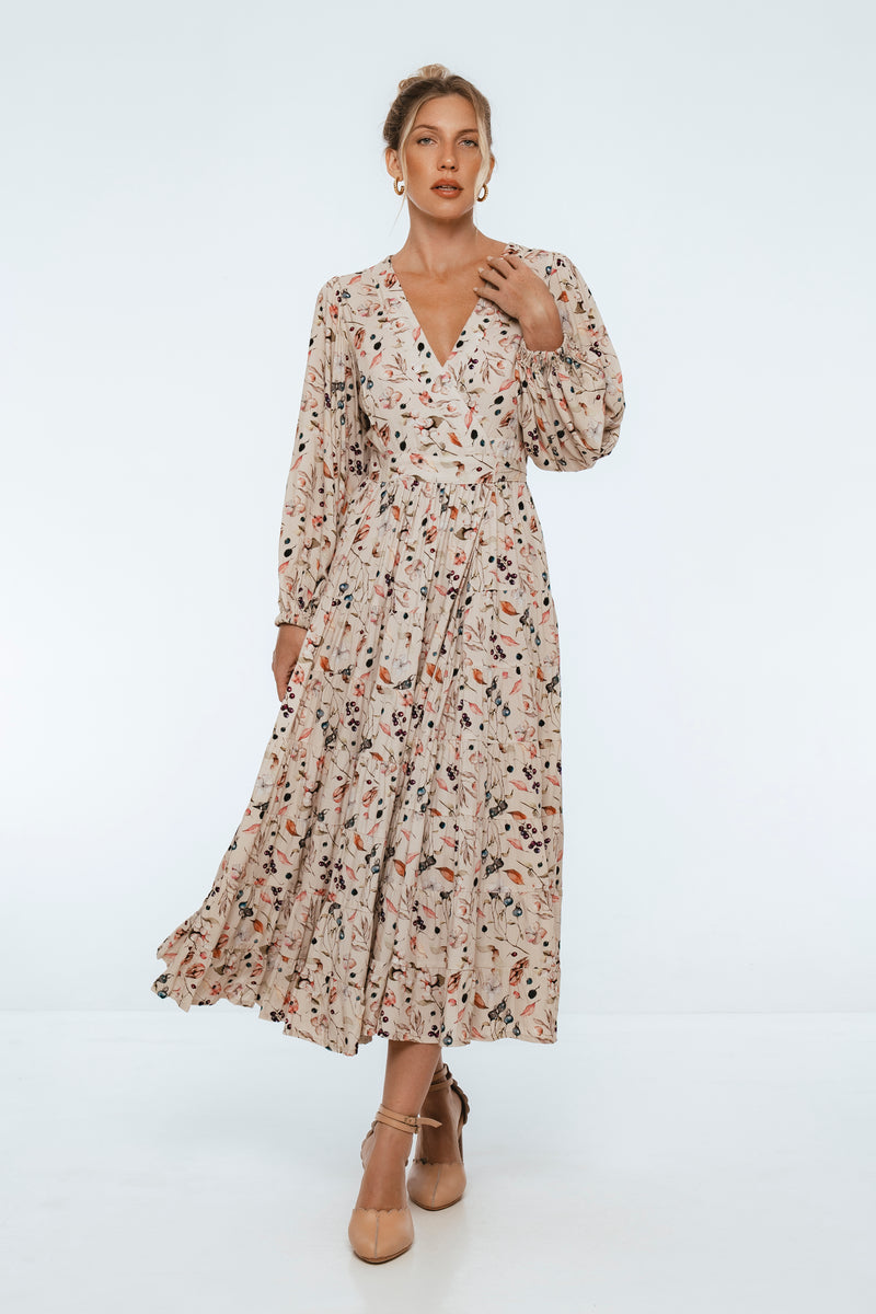 Woman wearing a floral dress on a white background