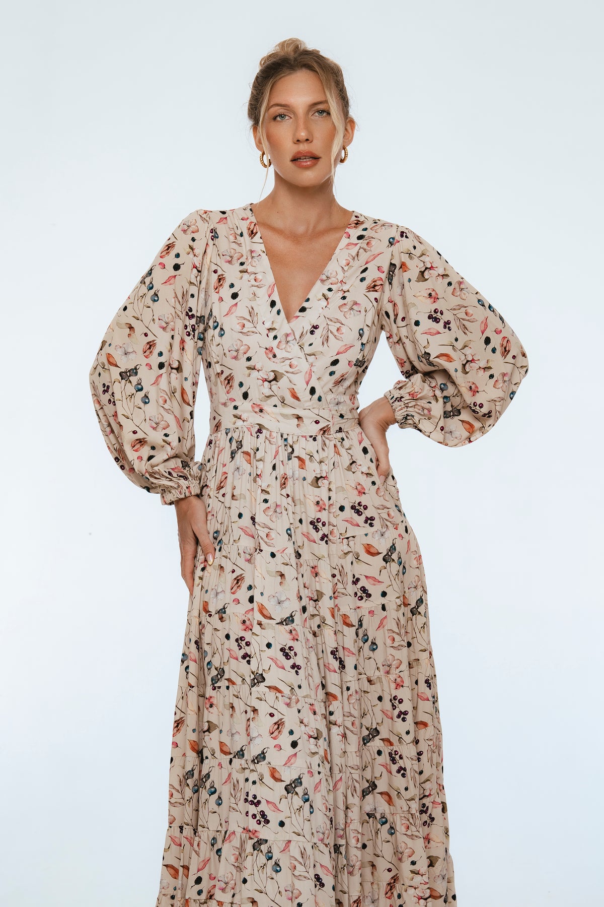 Woman wearing a floral dress on a white background