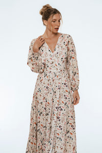 Woman wearing a floral dress on a white background