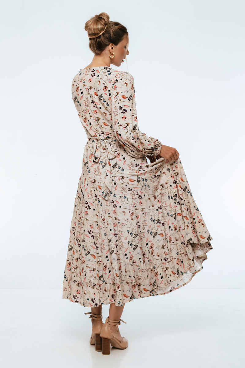 Woman wearing a floral dress on a white background