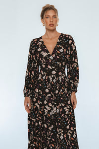 Woman wearing a floral dress on a white background