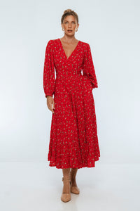 Woman wearing a red dress with a white background
