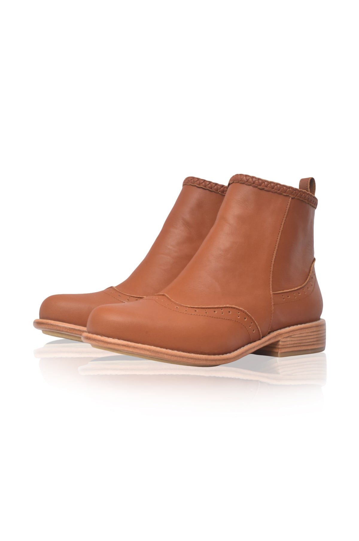 A pair of tan leather ankle boots with elastic side panels and low block heels, displayed on a clean white background with a soft reflection.
