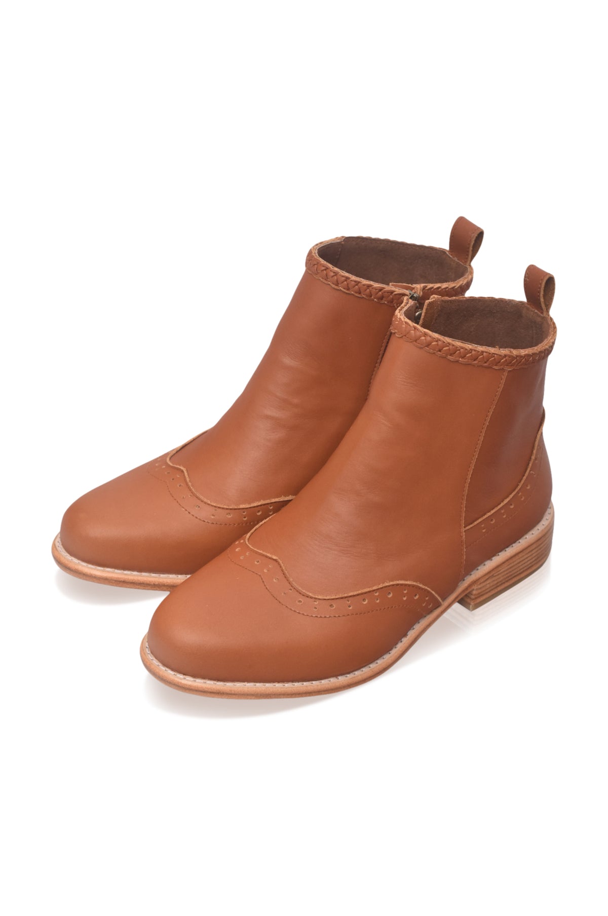 A pair of tan leather ankle boots with elastic side panels and pull tabs, shown on a clean white background.