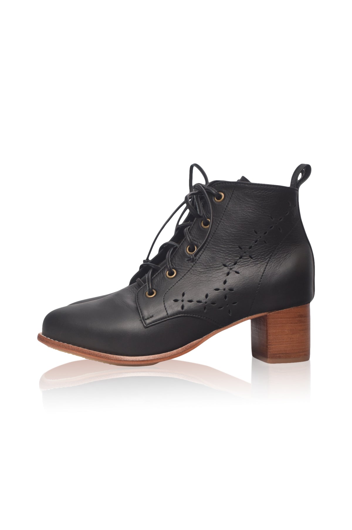 A black leather lace-up ankle boot with a block heel and decorative perforations on the side, shown against a plain white background with a soft reflection.