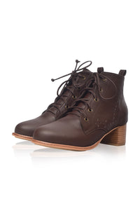 A pair of dark brown leather lace-up ankle boots with a stacked wooden block heel, displayed on a clean white background with a soft reflection.