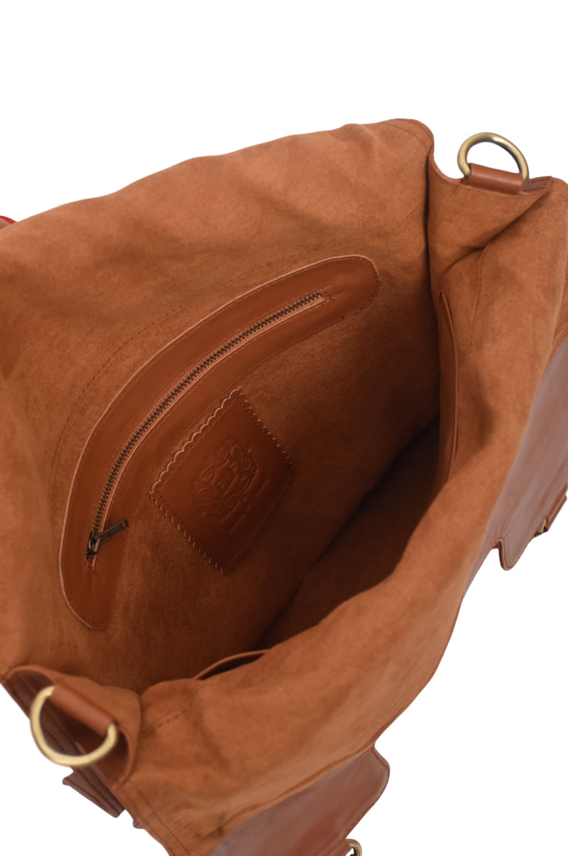 Brown leather bag with gold hardware on a white background