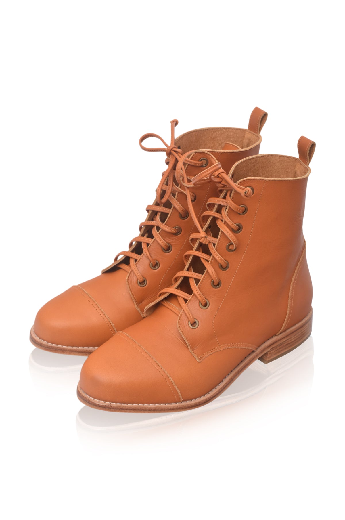 A pair of tan leather lace-up ankle boots with a low heel, displayed on a clean white background with a soft reflection.