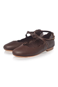Pair of brown leather shoes with a strap on a white background