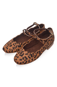 Leopard print ballet flats on a white background