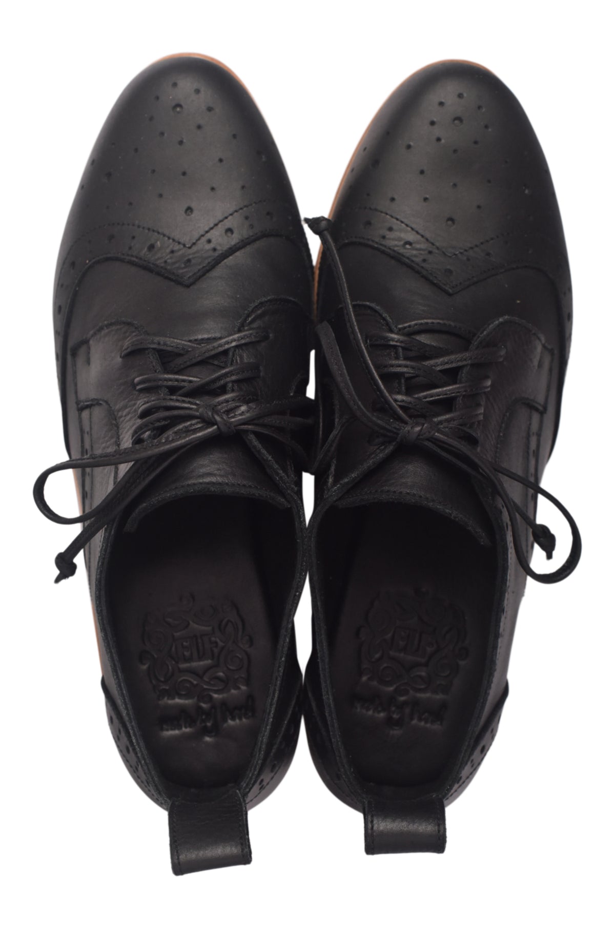 Pair of black leather shoes with laces on a white background