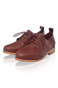 Brown leather shoes with lace-up design on a white background