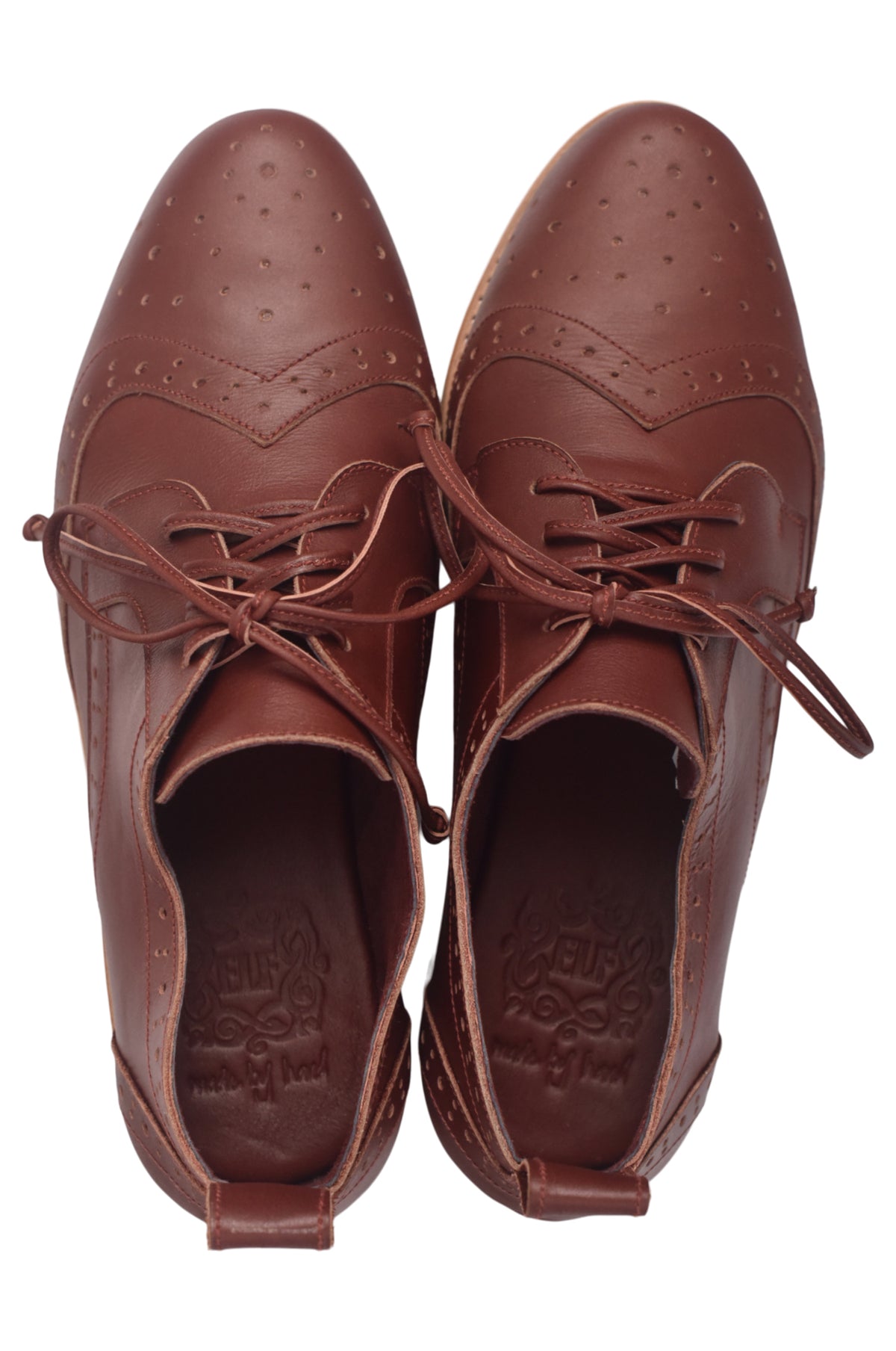 Pair of brown leather shoes with laces on a white background