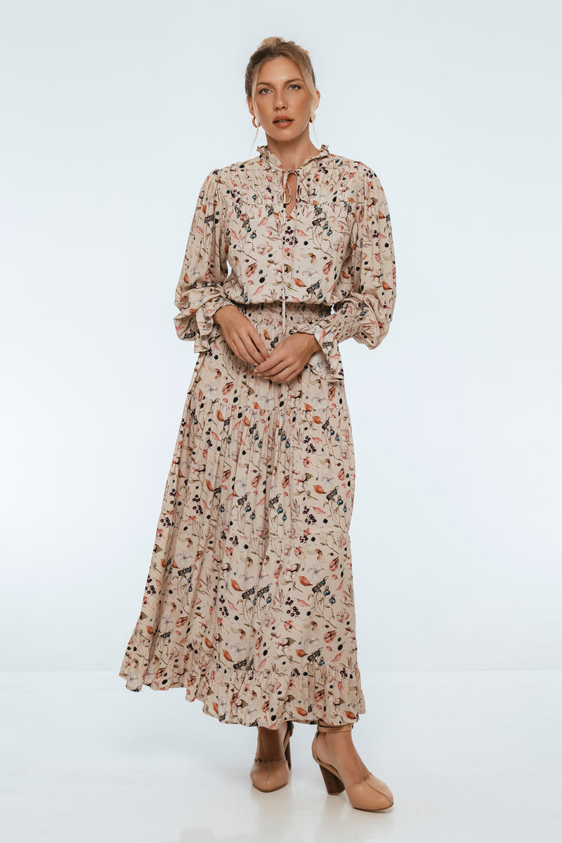 Woman wearing a floral dress on a white background