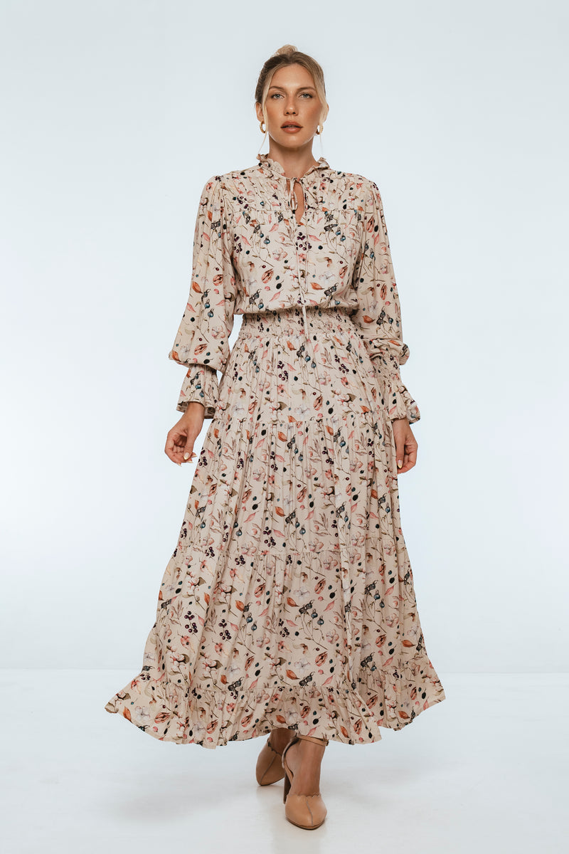 Woman wearing a floral dress on a white background