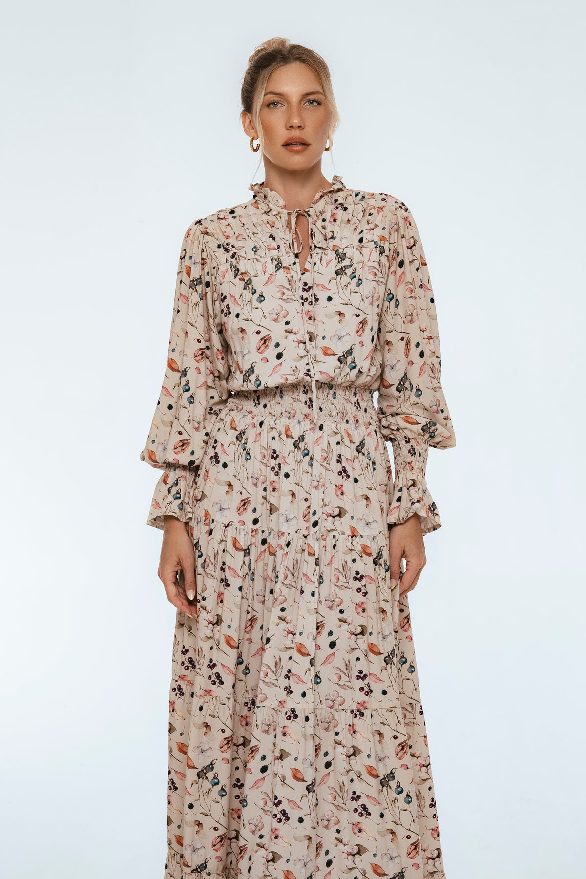 Woman wearing a floral dress on a white background