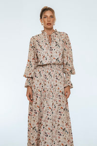 Woman wearing a floral dress on a white background