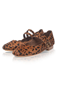 Pair of leopard print shoes with a strap on a white background