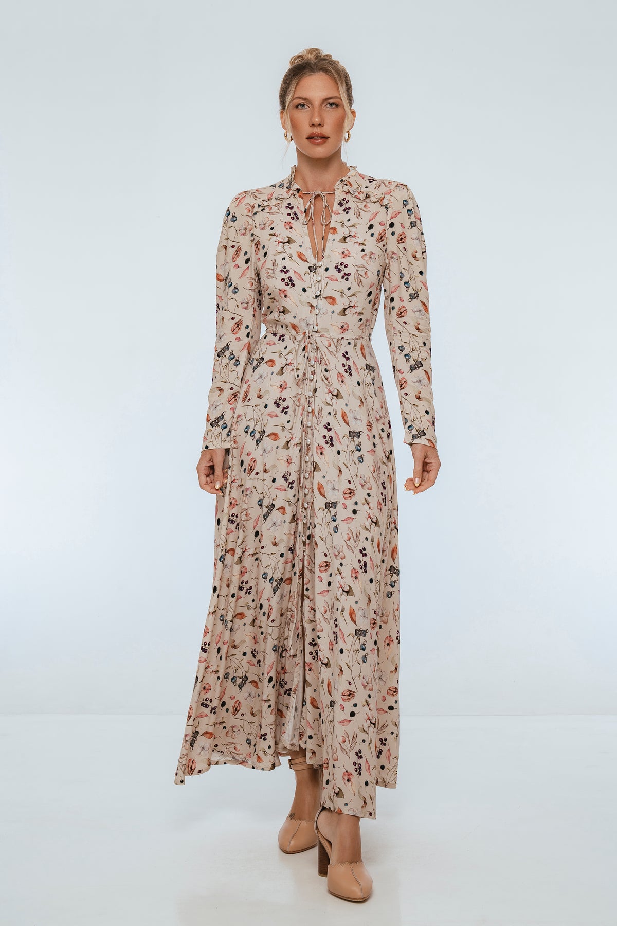 Woman wearing a floral dress on a white background