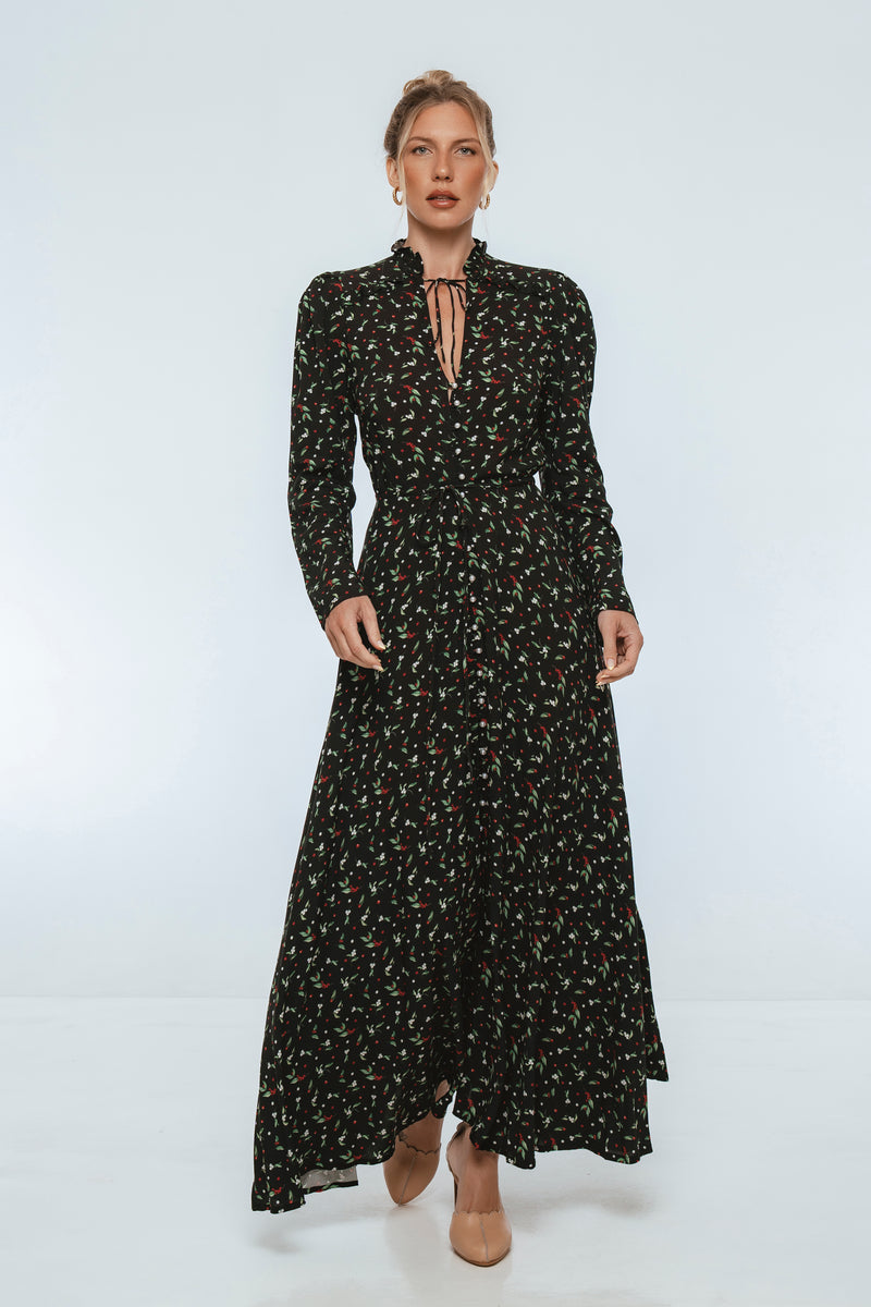 Woman wearing a black floral dress on a white background