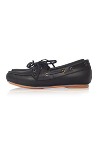Black leather boat shoe on a white background