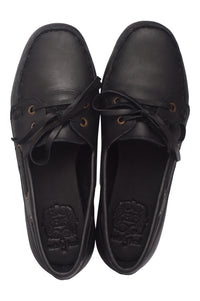 Pair of black leather shoes on a white background