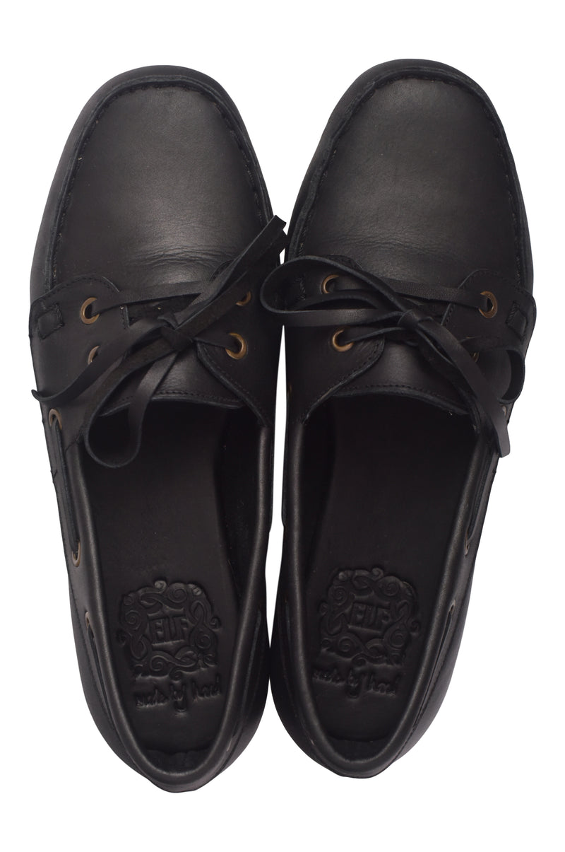 Pair of black leather shoes on a white background
