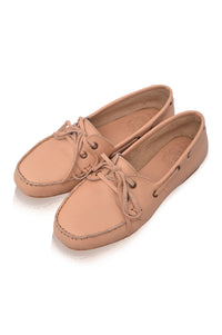 Pair of tan leather shoes on a white background