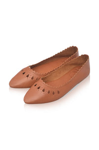 A pair of tan leather pointed-toe flats with decorative cutouts and scalloped edges, shown on a clean white background.