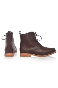 Pair of brown leather boots on a white background