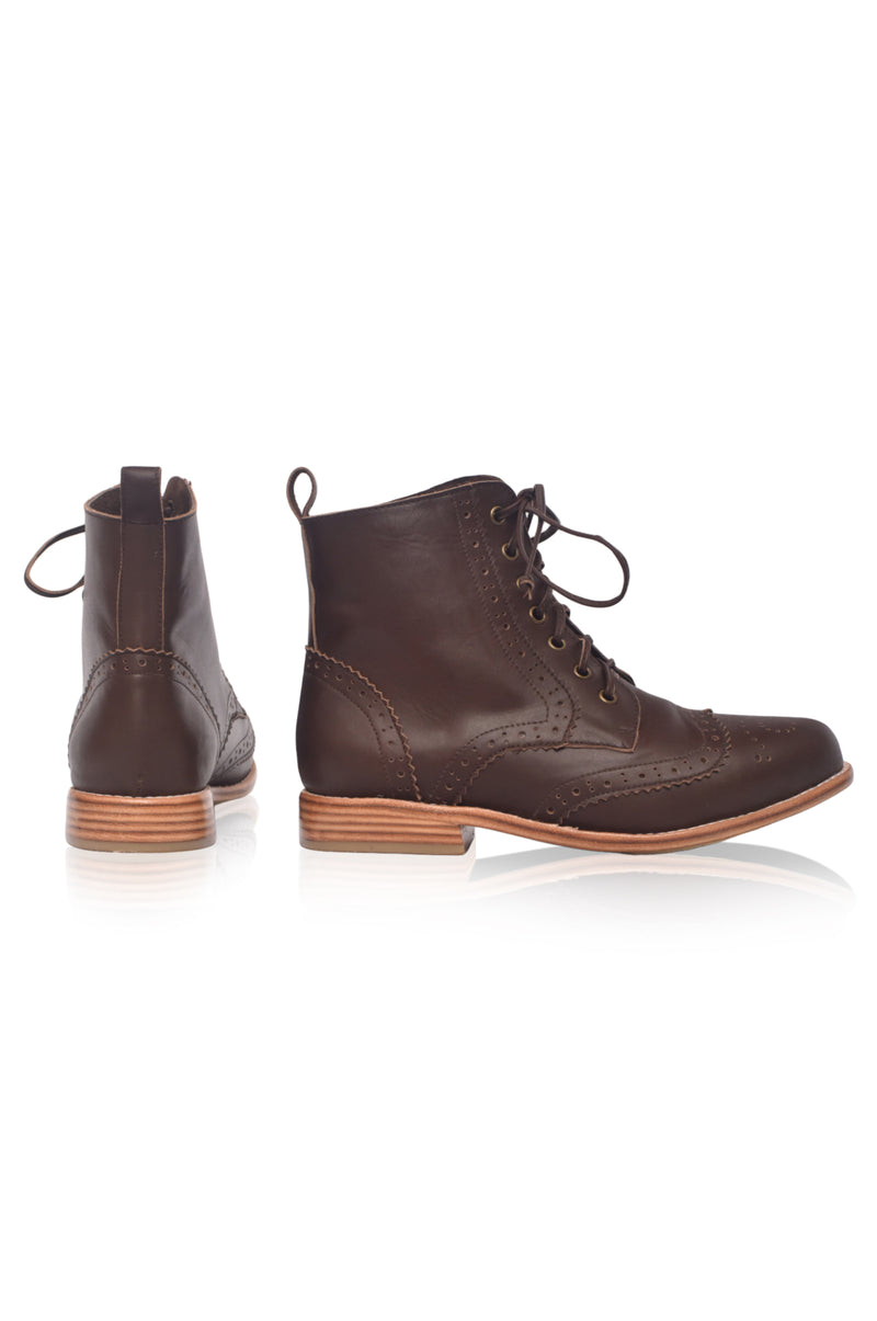 Pair of brown leather boots on a white background