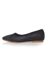 Black flat shoe on a white background