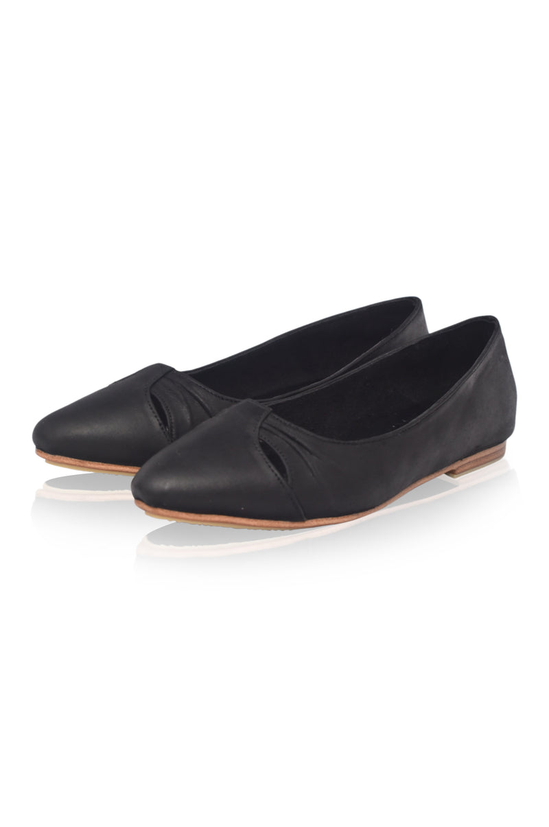 Pair of black flat shoes on a white background