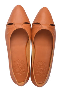 Pair of brown leather shoes with cut-out design on a white background