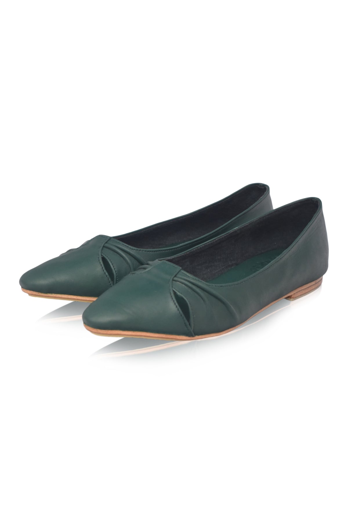 Pair of green flat shoes on a white background